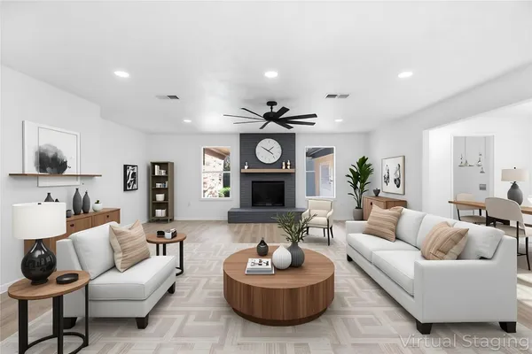a living room with furniture and a fireplace