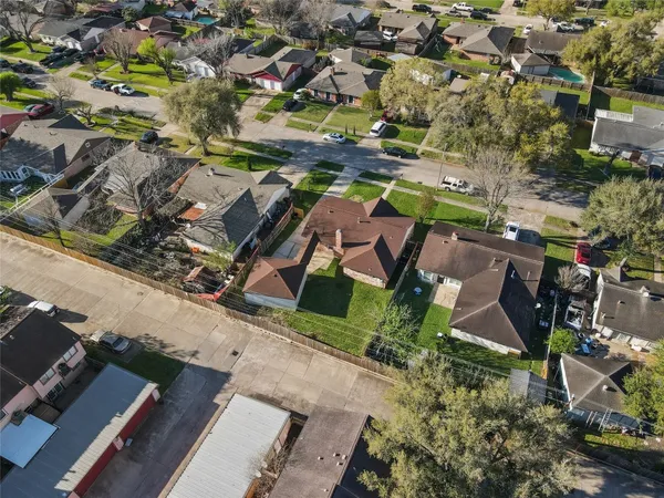 an aerial view of residential houses with outdoor space