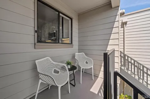 a kitchen with cabinets and wooden floor