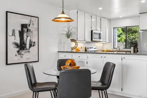 a bedroom with a large bed and a large window