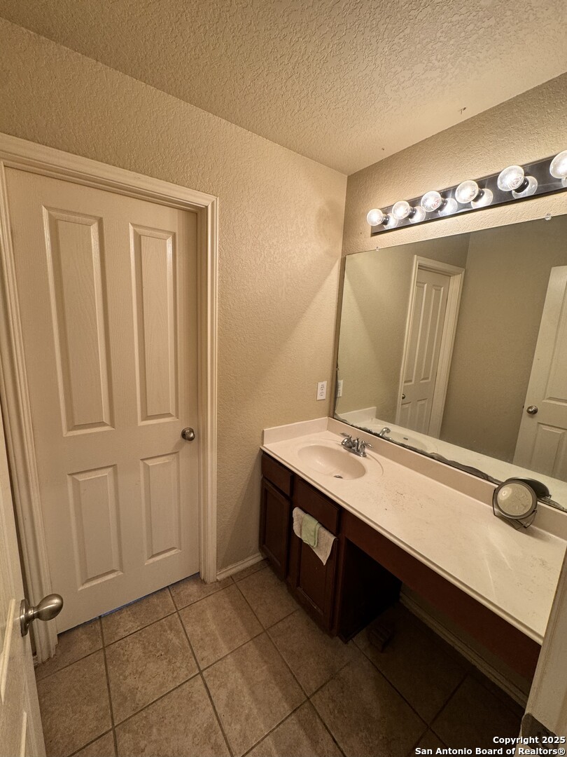 6714 Harbor Fields Converse, TX 78109 - Photo 11 of 29 a bathroom with a sink double vanity and a mirror