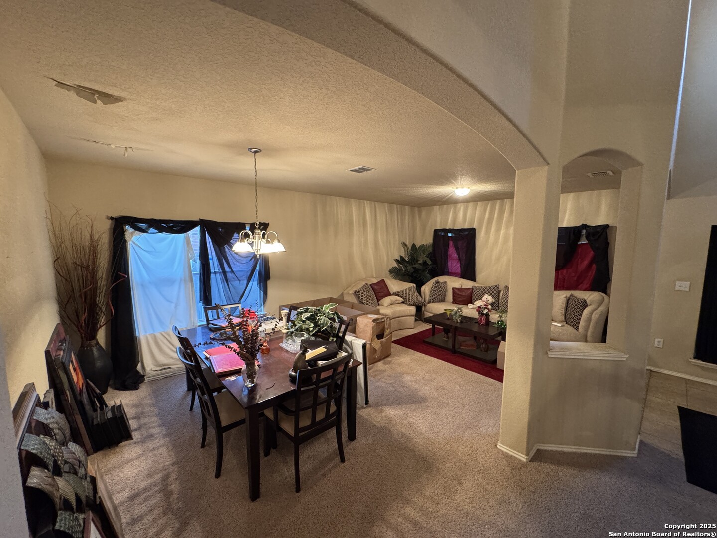 6714 Harbor Fields Converse, TX 78109 - Photo 17 of 29 a living room with furniture and a chandelier