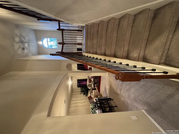 a view of a living room with furniture and a fireplace