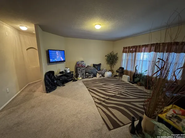 a bed room with a bed and a flat screen tv