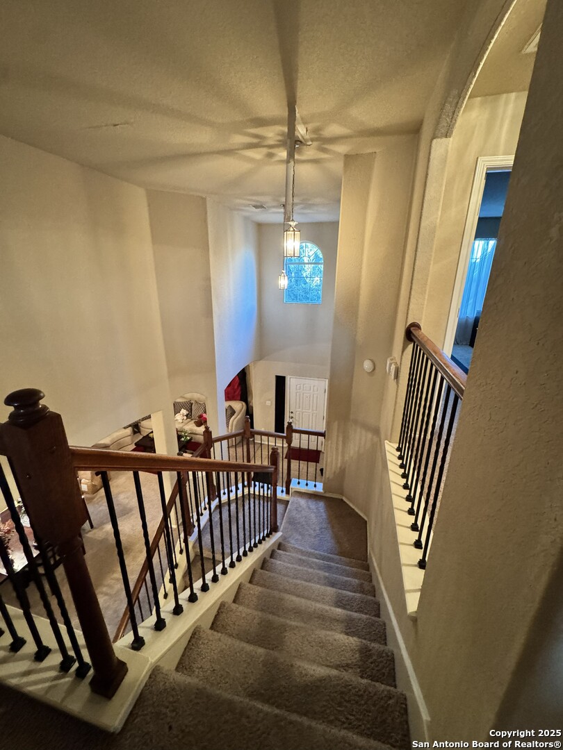 6714 Harbor Fields Converse, TX 78109 - Photo 5 of 29 a view of a hallway with wooden floor and stairs