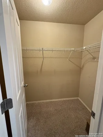 a view of a room with racks on the wall