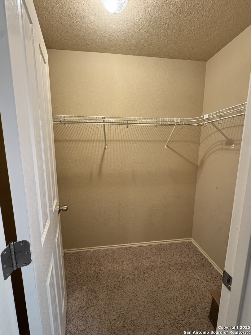 6714 Harbor Fields Converse, TX 78109 - Photo 6 of 29 a view of a room with racks on the wall