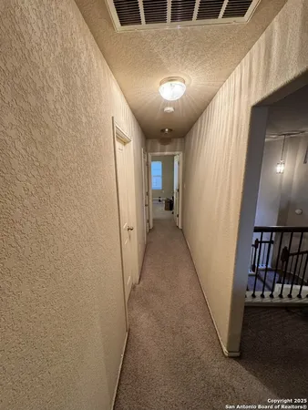 a view of hallway with stairs