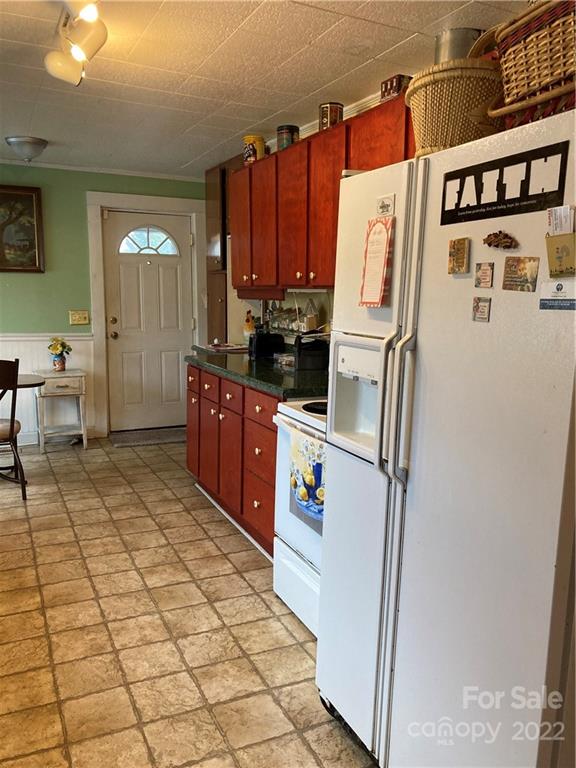 135 Allen Street Rutherfordton, NC 28139 - Photo 7 of 10 a kitchen with stainless steel appliances a refrigerator and a stove