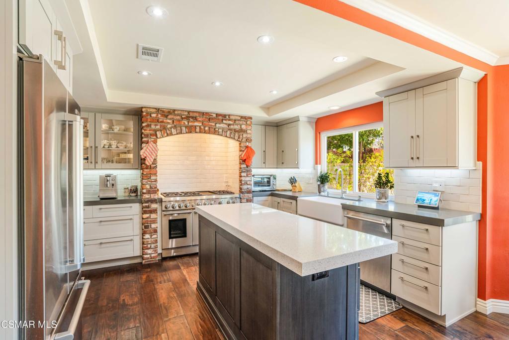 764 Coldbrook Place Simi Valley, CA 93065 - Photo 14 of 56 a kitchen with a sink stove and refrigerator