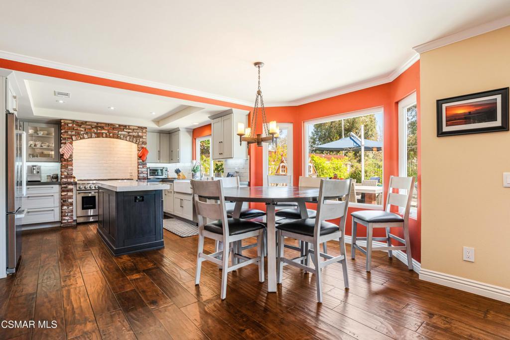 764 Coldbrook Place Simi Valley, CA 93065 - Photo 16 of 56 a view of a dining room with furniture window and wooden floor