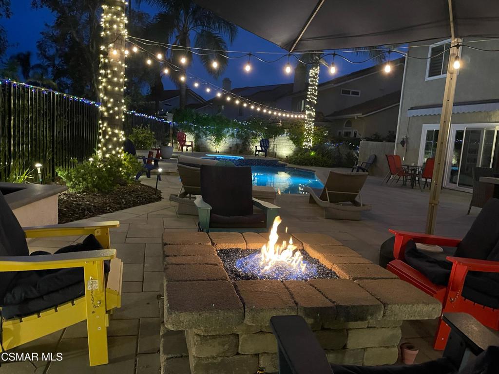 764 Coldbrook Place Simi Valley, CA 93065 - Photo 2 of 56 a view of a patio with dining table and chairs with a fire pit
