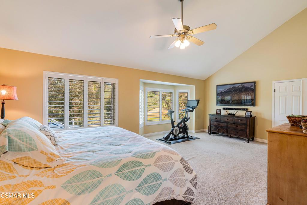 764 Coldbrook Place Simi Valley, CA 93065 - Photo 30 of 56 a bedroom with a bed a window and a flat screen television