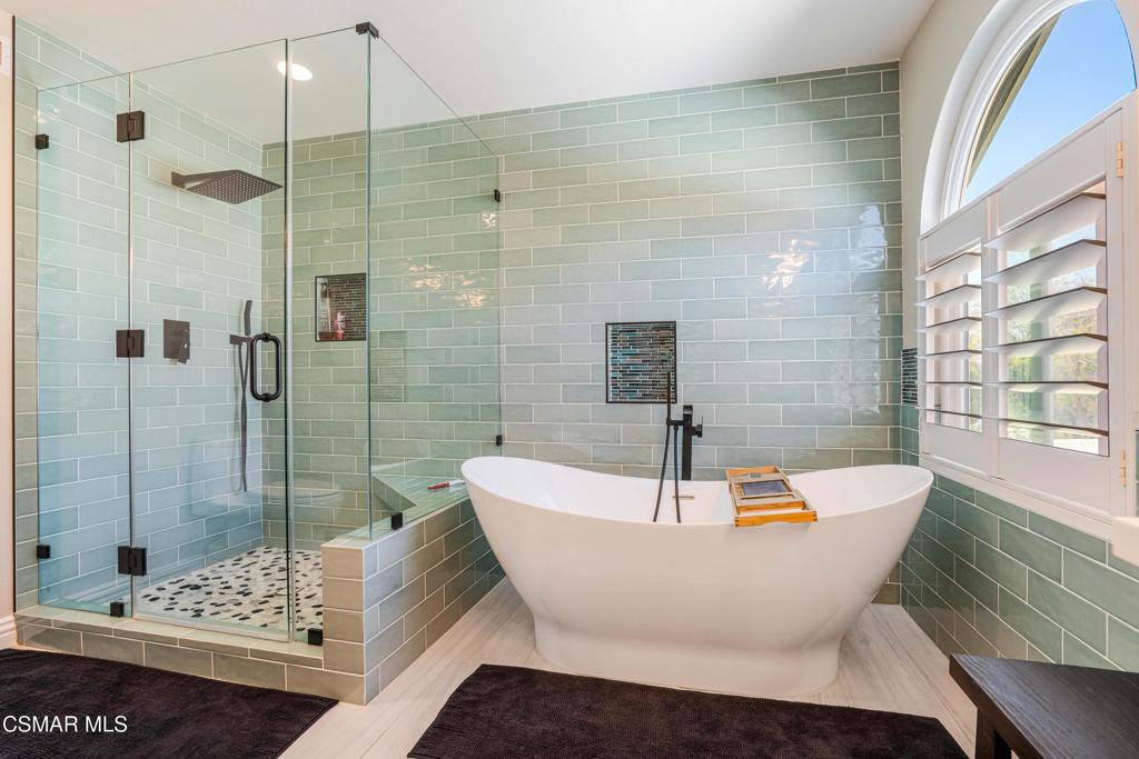 764 Coldbrook Place Simi Valley, CA 93065 - Photo 32 of 56 a white bath tub sitting next to a bathroom