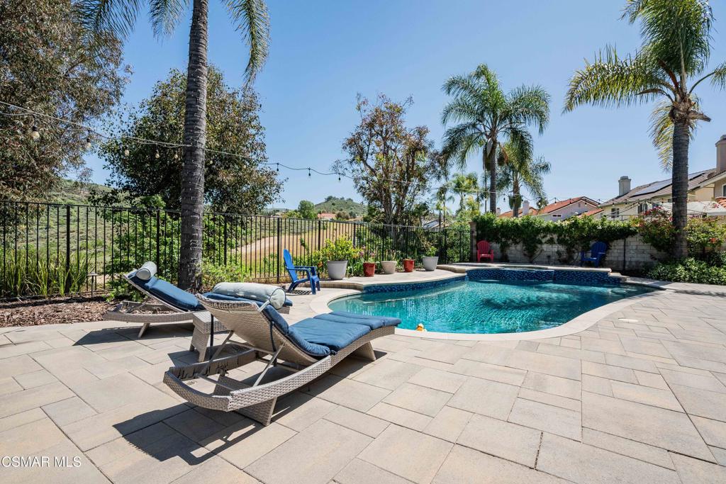 764 Coldbrook Place Simi Valley, CA 93065 - Photo 37 of 56 a view of a swimming pool and lounge chair