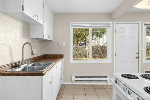a kitchen that has a sink and a window