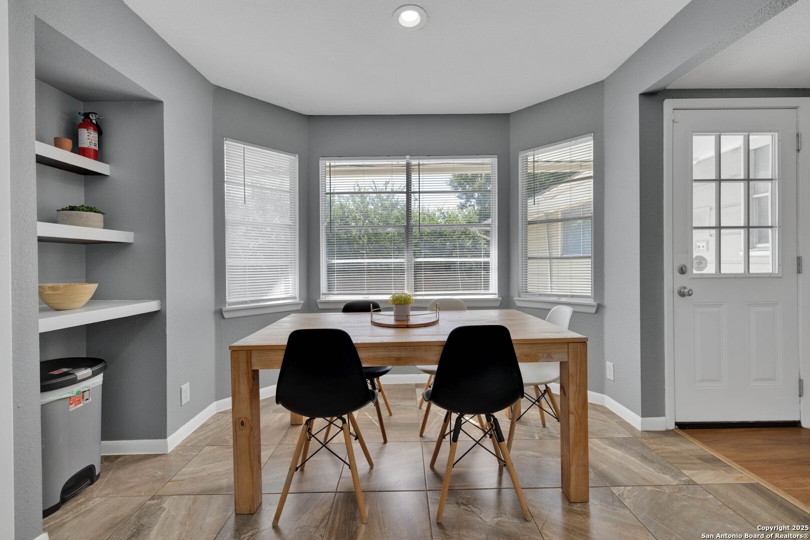 103 Shalimar Drive Castle Hills, TX 78213 - Photo 11 of 56 a view of a dining room with furniture and a window