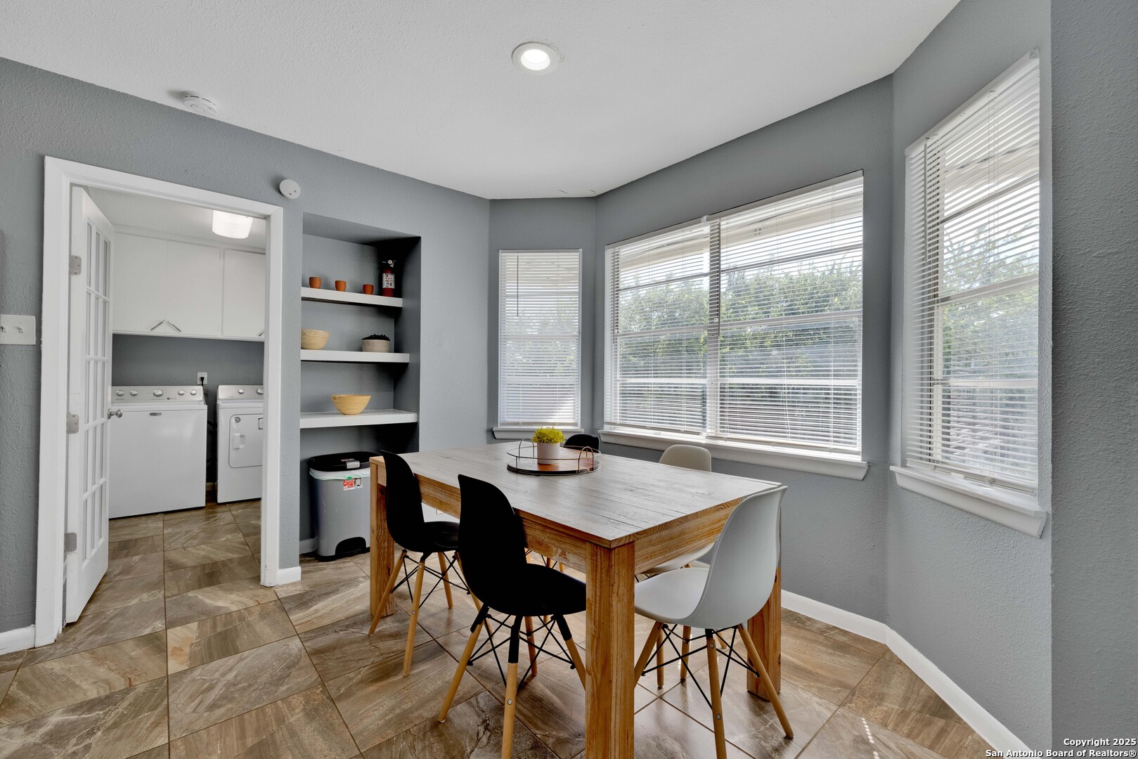 103 Shalimar Drive Castle Hills, TX 78213 - Photo 12 of 56 a view of a dining room with furniture and a window