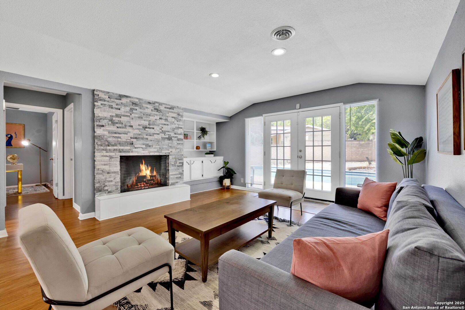 103 Shalimar Drive Castle Hills, TX 78213 - Photo 17 of 56 a living room with furniture and a fireplace