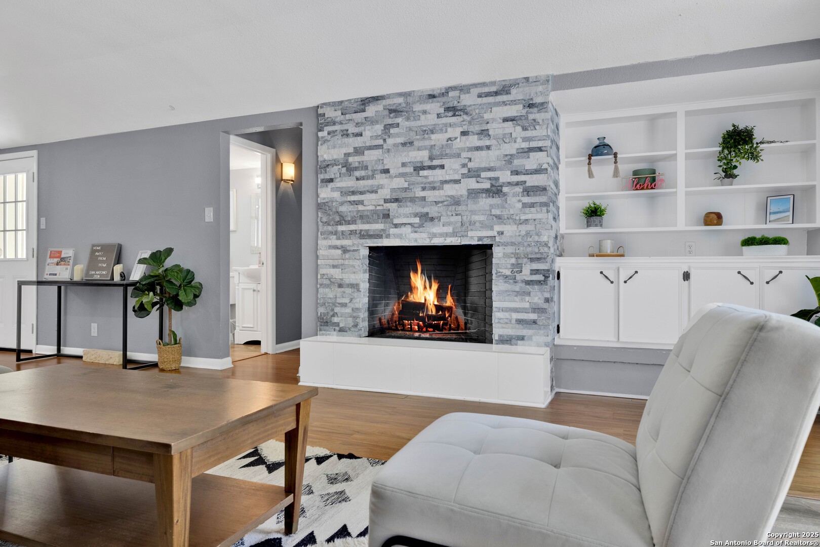 103 Shalimar Drive Castle Hills, TX 78213 - Photo 20 of 56 a living room with furniture and a fireplace
