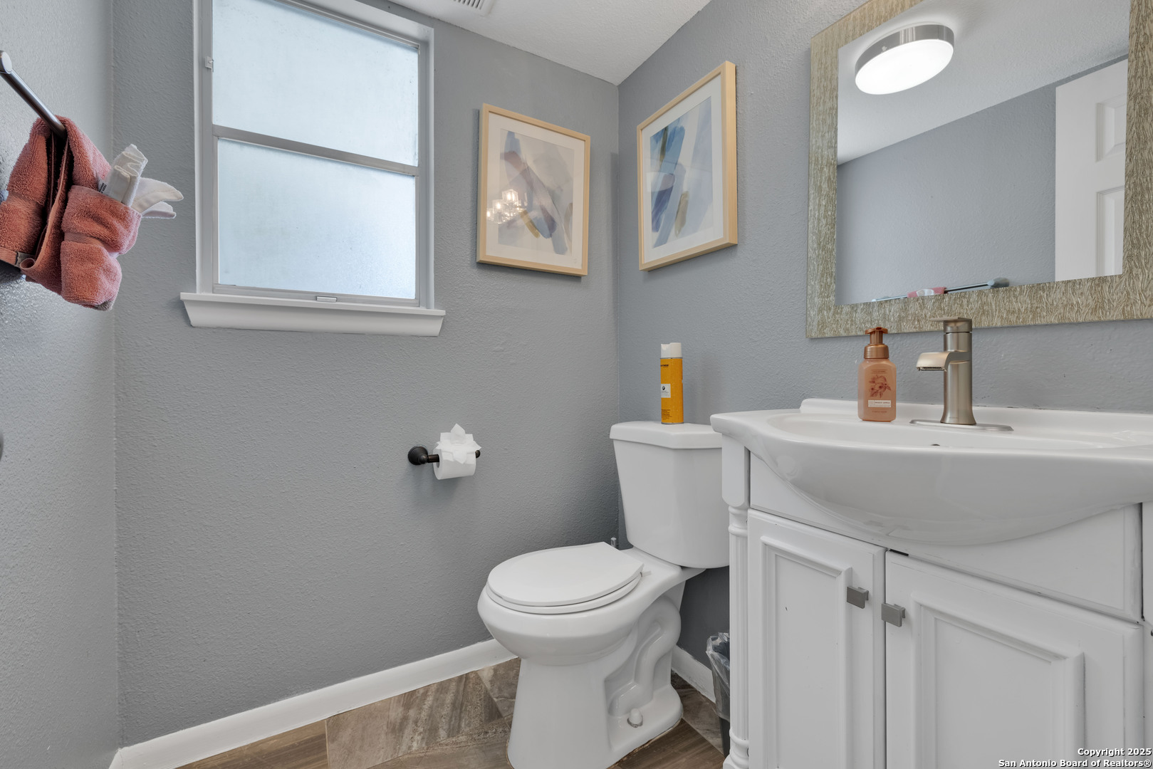 103 Shalimar Drive Castle Hills, TX 78213 - Photo 24 of 56 a bathroom with a toilet a sink and a window
