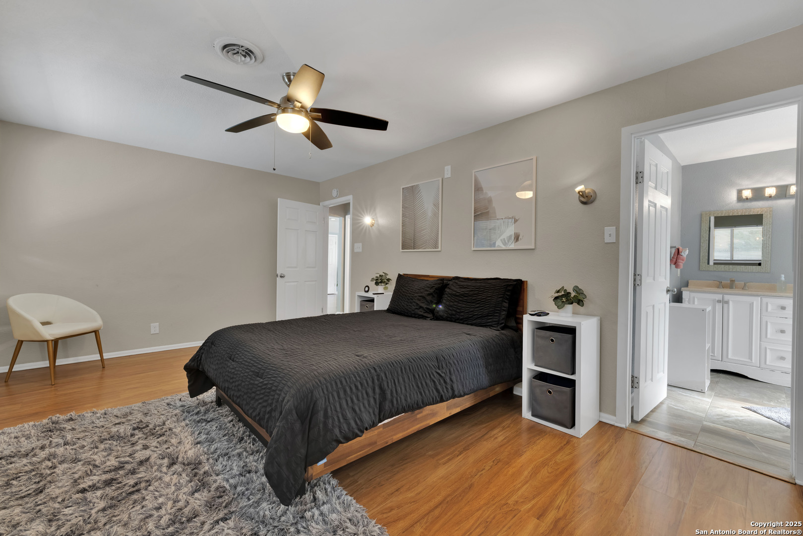 103 Shalimar Drive Castle Hills, TX 78213 - Photo 28 of 56 a spacious bedroom with a bed and a chandelier