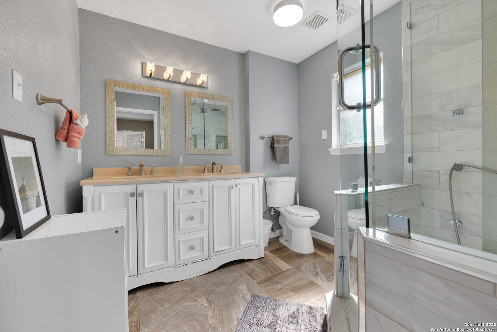 103 Shalimar Drive Castle Hills, TX 78213 - Photo 30 of 56 a bathroom with a toilet a sink and a mirror