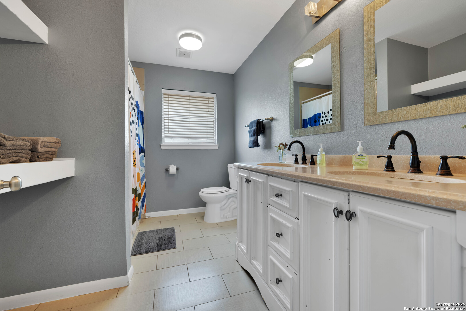 103 Shalimar Drive Castle Hills, TX 78213 - Photo 42 of 56 a bathroom with a double vanity sink mirror and toilet