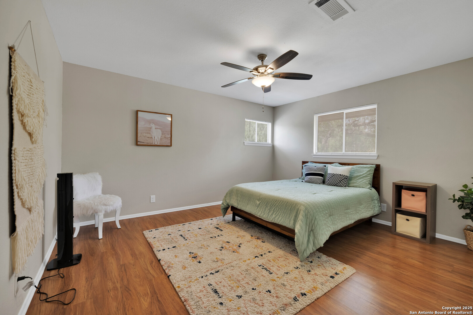 103 Shalimar Drive Castle Hills, TX 78213 - Photo 43 of 56 a bedroom with a bed and a wooden floor