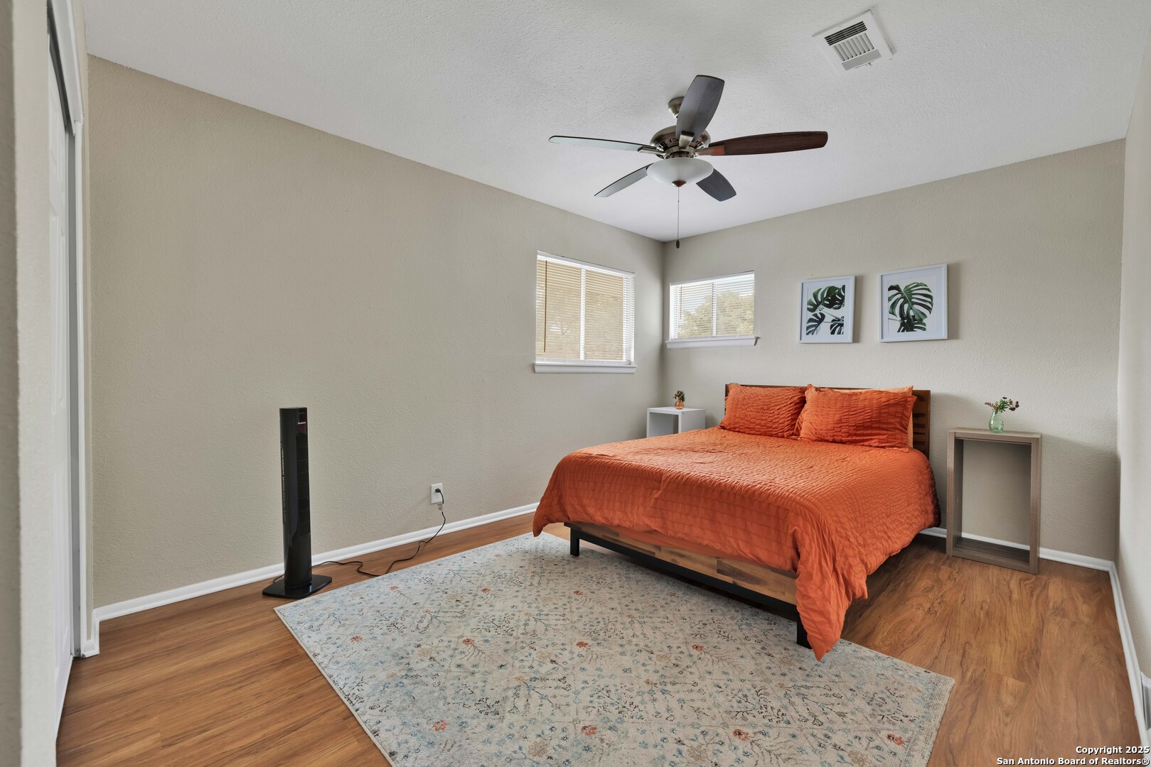 103 Shalimar Drive Castle Hills, TX 78213 - Photo 45 of 56 a bedroom with a bed and a chandelier