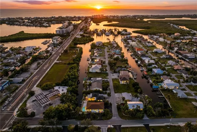 an aerial view of residential building and lake