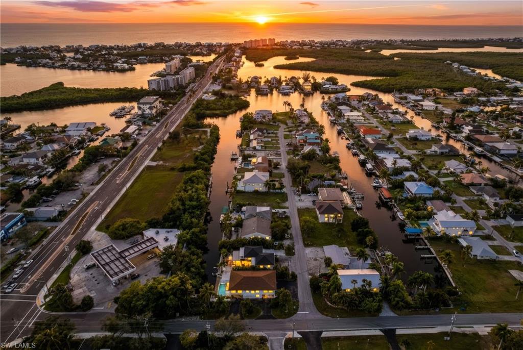 4811 Gary Road Bonita Springs, FL 34134 - Photo 2 of 35 Aerial view at dusk of a water view