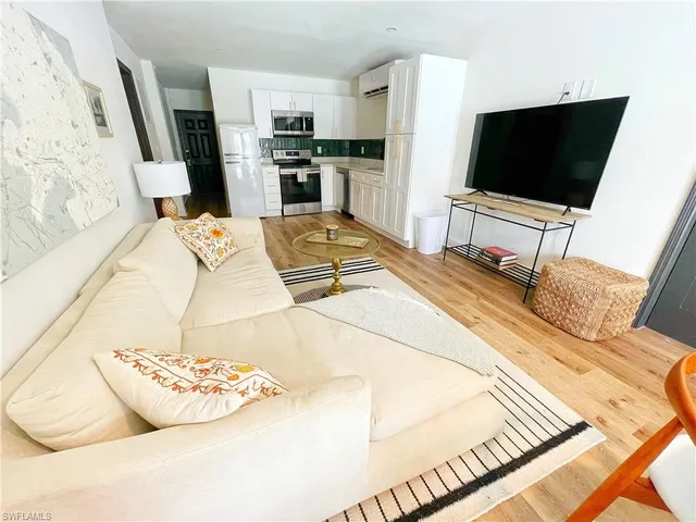 an aerial view of a houses with yard