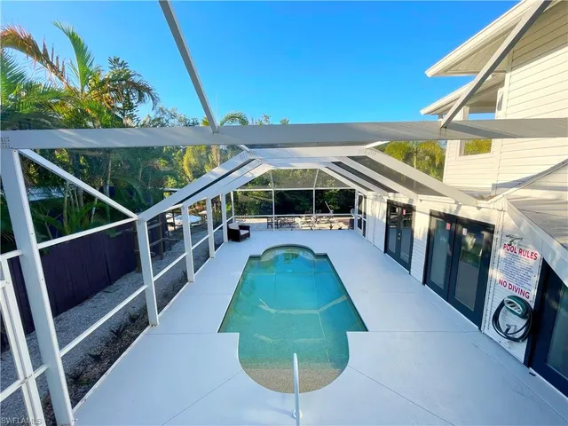 a view of a balcony with chairs
