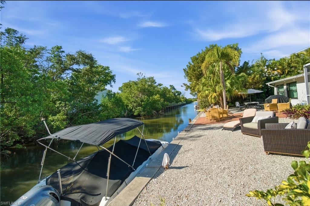 4811 Gary Road Bonita Springs, FL 34134 - Photo 6 of 35 Dock featuring a water view and a patio