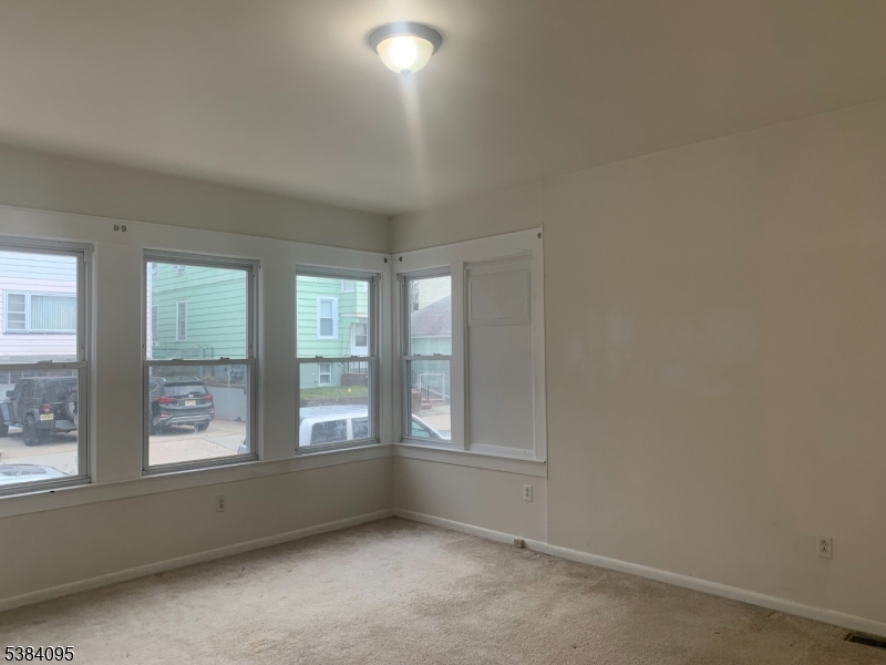 10 Exchange Place Clifton, NJ 07011 - Photo 16 of 19 an empty room with windows