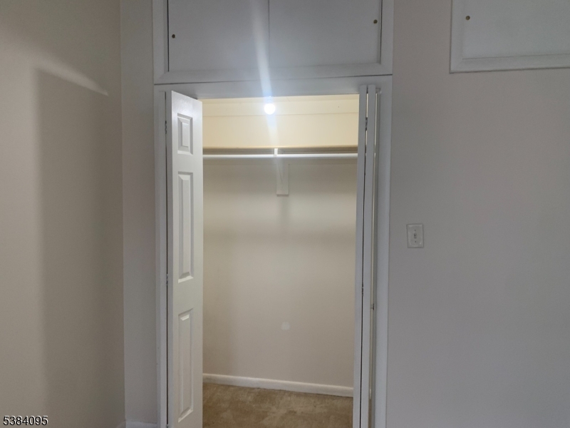 10 Exchange Place Clifton, NJ 07011 - Photo 17 of 19 a close view of refrigerator cabinet