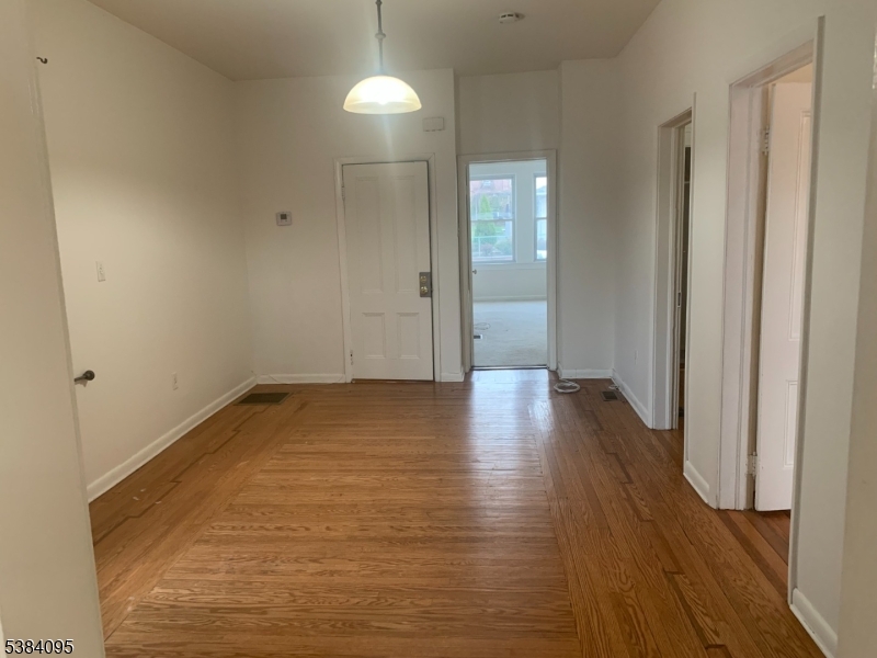10 Exchange Place Clifton, NJ 07011 - Photo 3 of 19 a view of a room with wooden floor