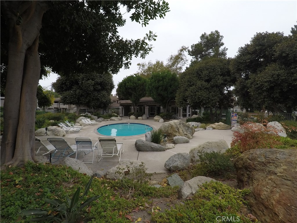 230 Springview Irvine, CA 92620 - Photo 19 of 30 a view of a chair and table in the garden