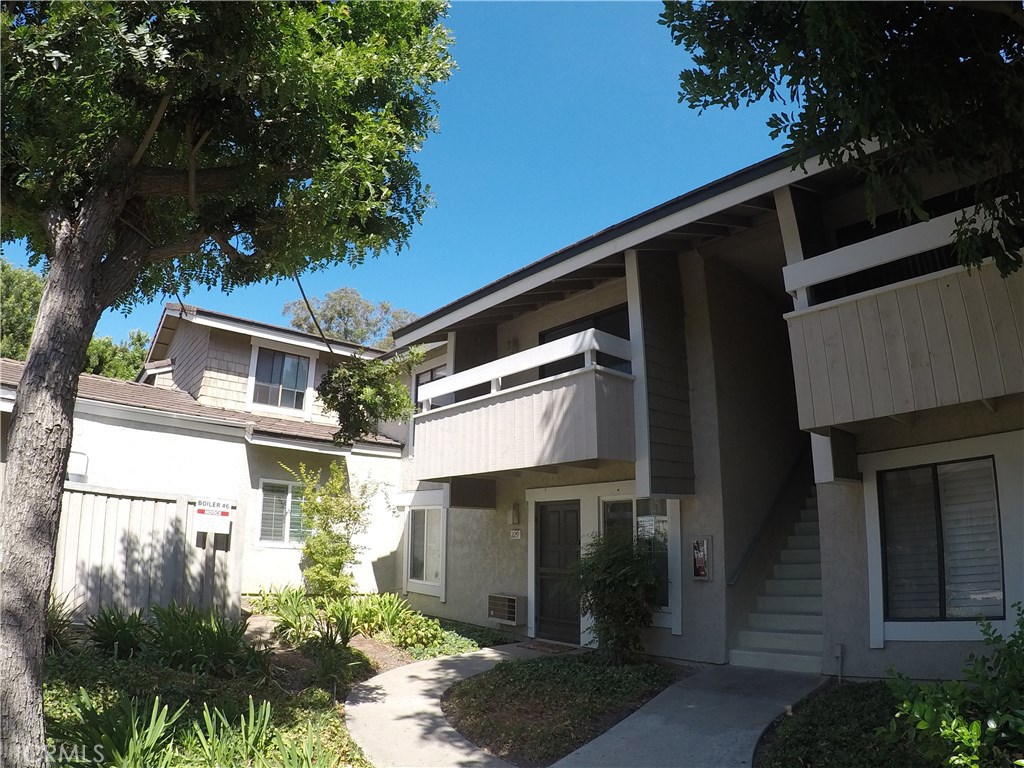 230 Springview Irvine, CA 92620 - Photo 2 of 30 a front view of a house with a garden