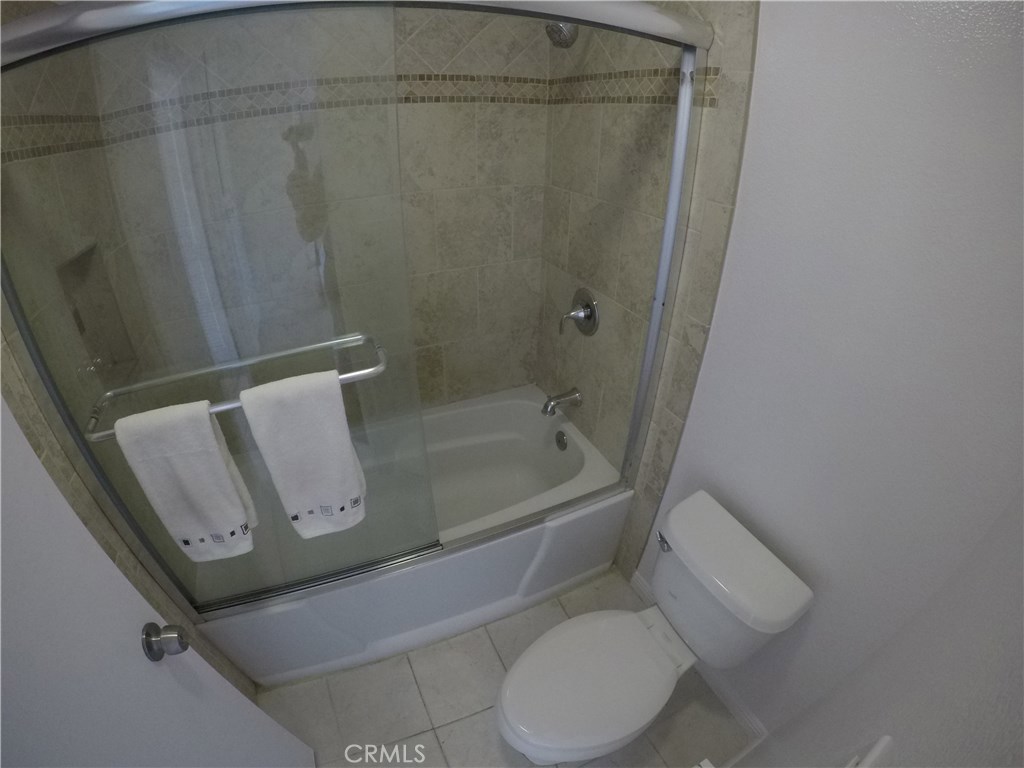 230 Springview Irvine, CA 92620 - Photo 3 of 30 a bathroom with a toilet and shower