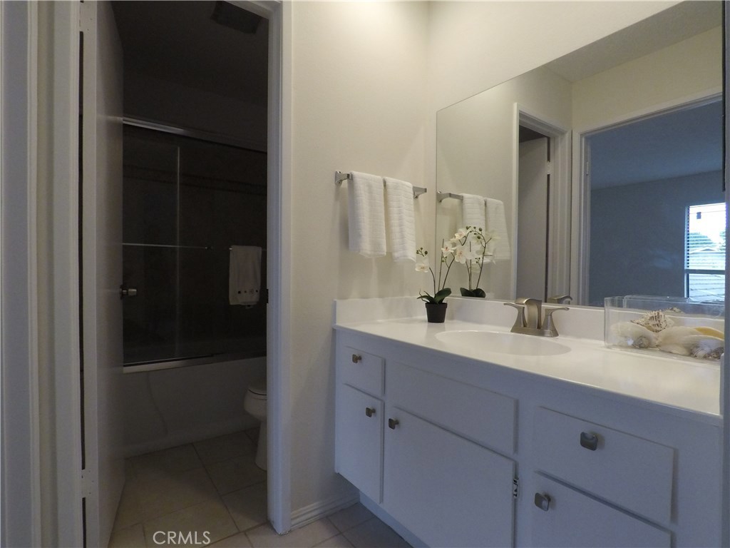 230 Springview Irvine, CA 92620 - Photo 4 of 30 a bathroom with a double vanity sink and mirror
