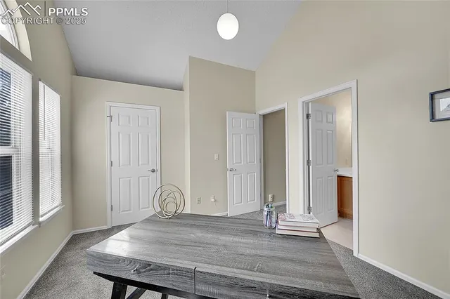 a view of a livingroom with wooden floor and window