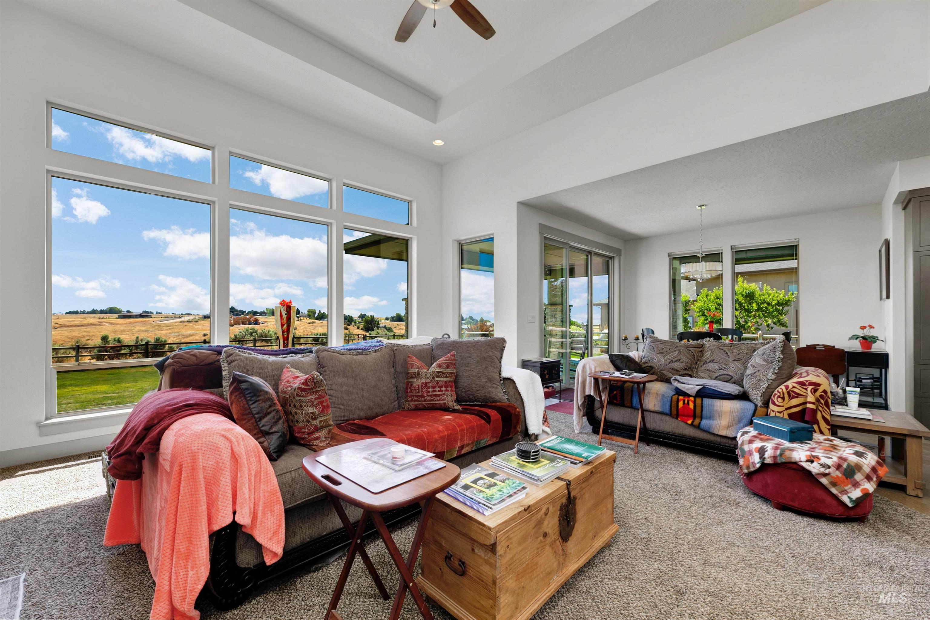 24398 Tombstone Ridge Court Middleton, ID 83644 - Photo 25 of 47 Expansive living area with large picture windows and a tray ceiling