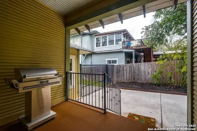 a view of a house with a yard and balcony