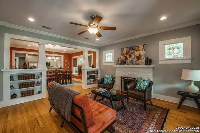 a living room with furniture and a fireplace