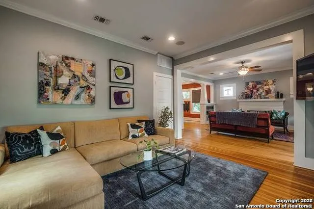 a living room with furniture and a rug