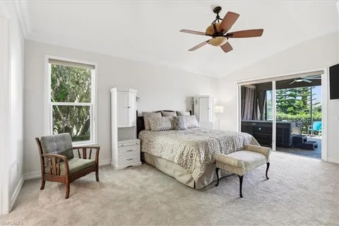 a bed room with a bed and a chair