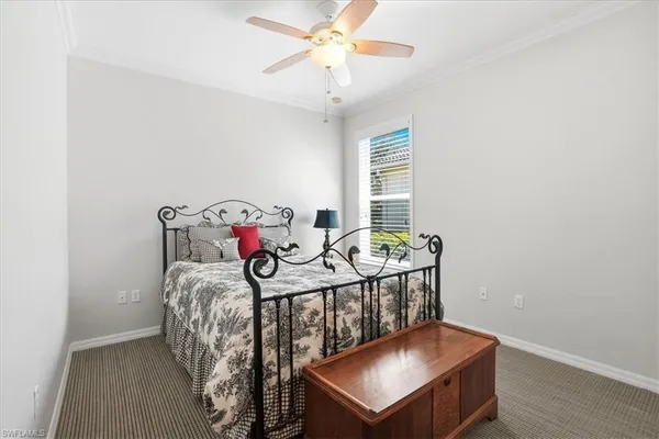 a bedroom with furniture and a window
