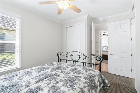 a bedroom with a bed a table and chair